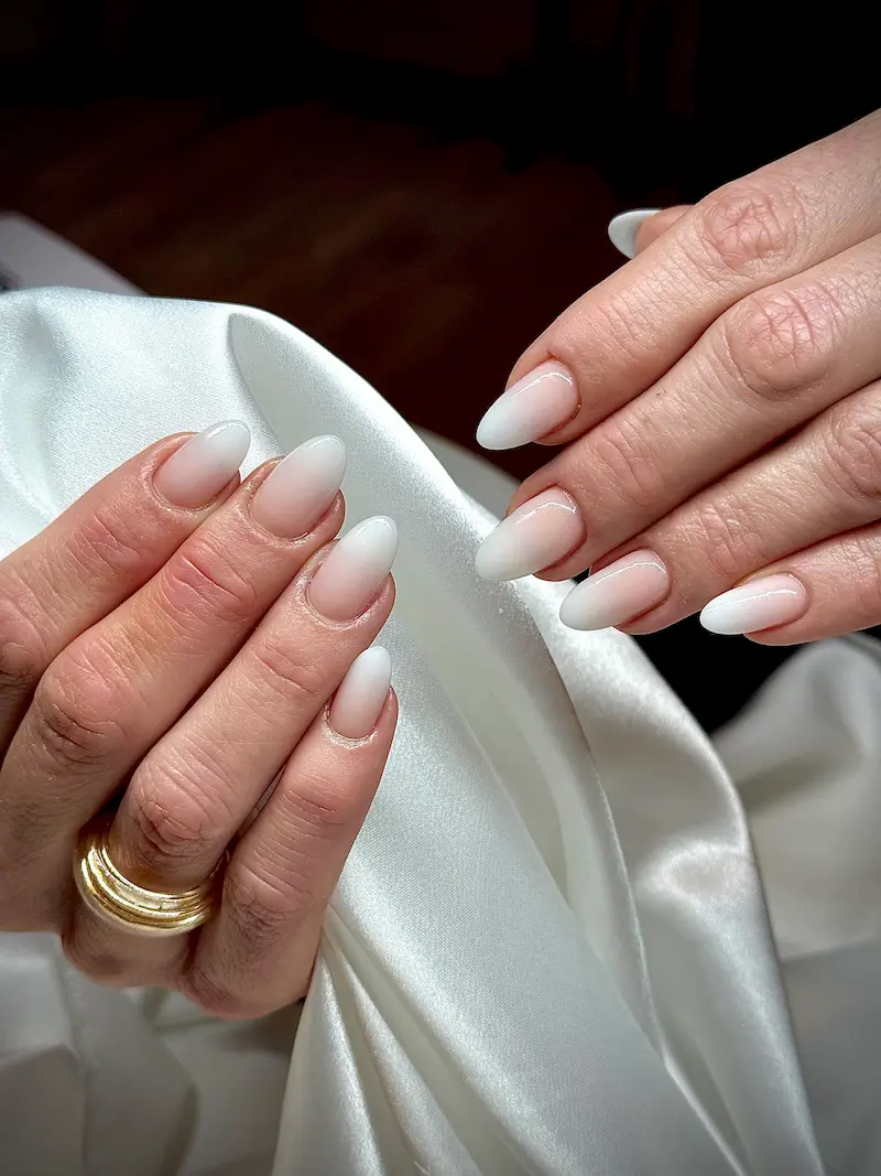 Modern ombre gradient manicure and nail art at our nail salon in Fribourg